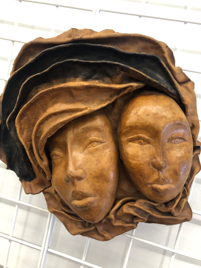 2 EMBOSSED WOMAN FACES MADE OF LEATHER WALL ART.