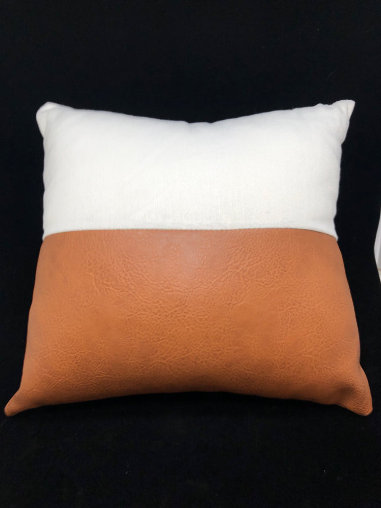 WHITE/BROWN LEATHER PILLOW.