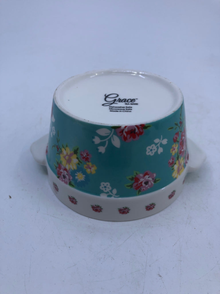 2 MINI CROCKS W/ TEAL COLORFUL FLOWERS.