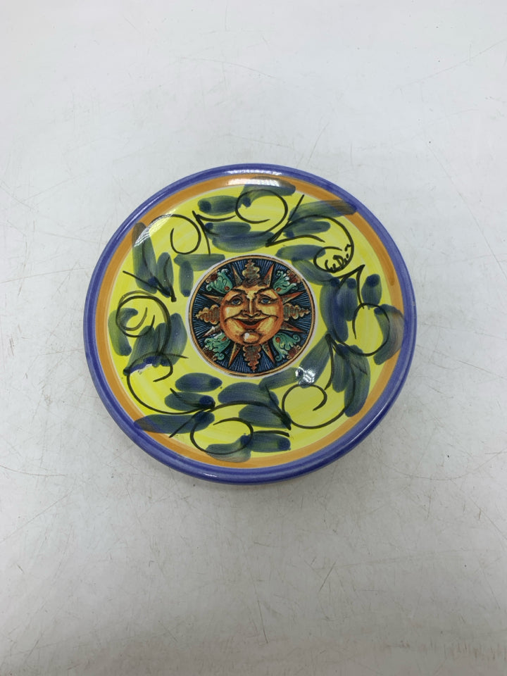 SMALL CERAMIC PLATE W/ DETAILED SUN IN CENTER.