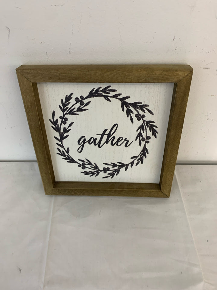 GATHER WALL HANGING IN WOOD FRAME.