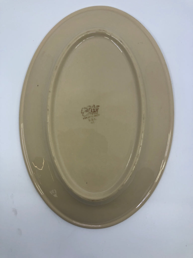 4 TAN OVAL DINNER PLATES.