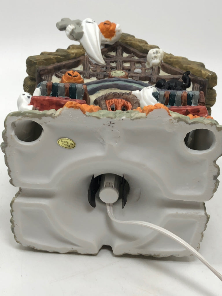 PORCELAIN ILLUMINATED HAUNTED HOUSE W/GHOSTS.