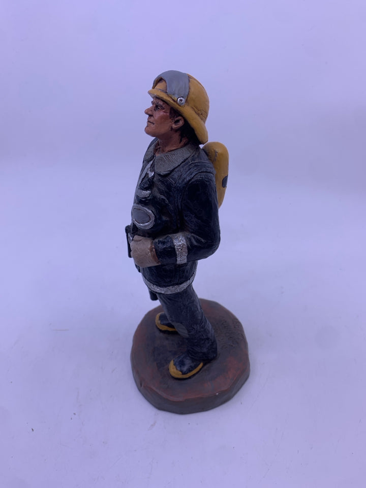FIRE MAN STANDING FIGURE- MICHAEL GARMAN.