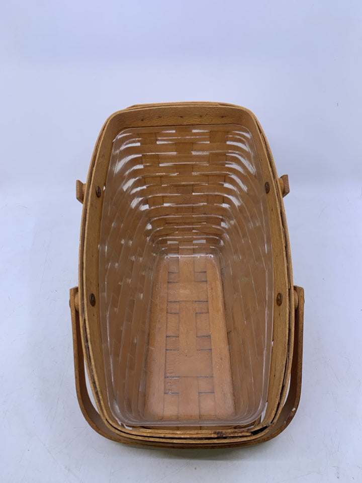 1994 MEDIUM VEGETABLE BASKET W/ HANDLES PLASTIC PROTECTOR.