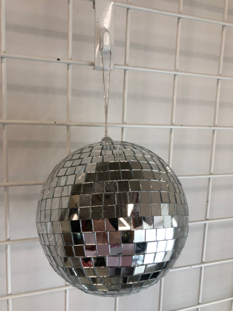 SILVER DISCO BALL ORNAMENT.