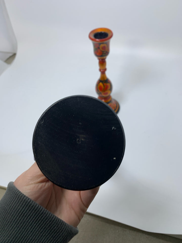 2 PAINTED RUSSIAN RED/BLACK FLORAL WOODEN TAPERED CANDLE HOLDERS.