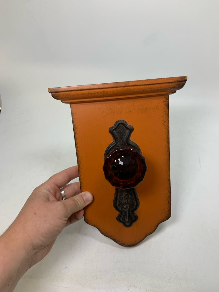 RUSTING DOOR KNOB HOOK WALL HANGING.