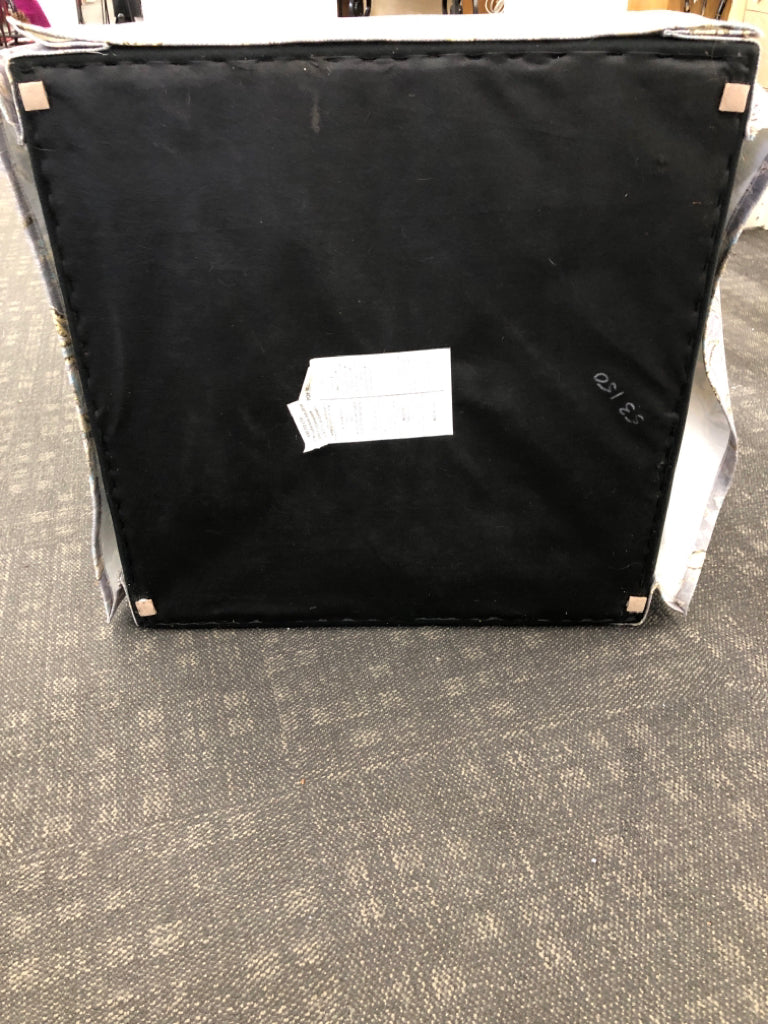 GREY FLORAL UPHOLSTERED OTTOMAN.