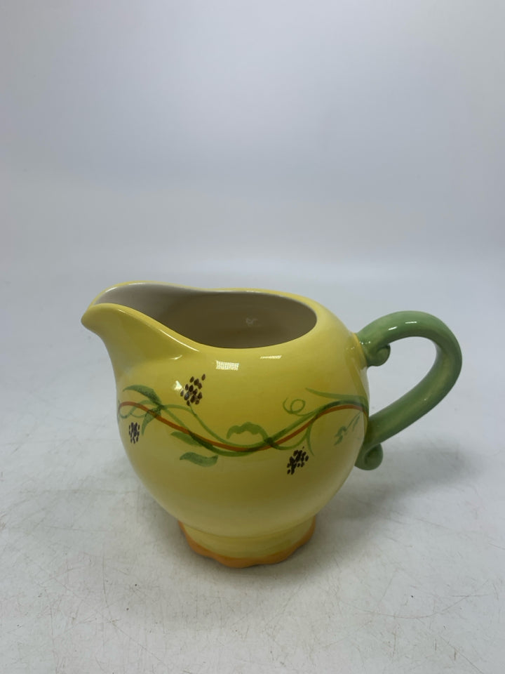 FOOTED CREAMER W/ VINE DETAILS.
