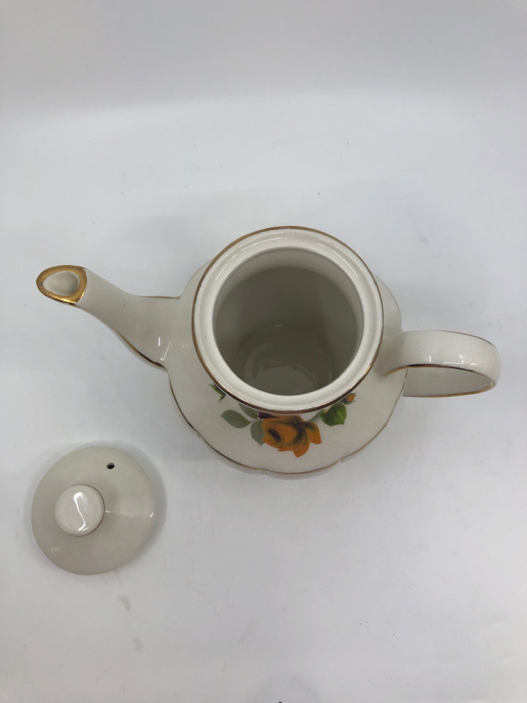 VTG YELLOW FLORAL W GOLD ACCENT TEAPOT.