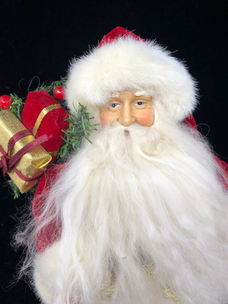 SANTA W/ LONG BEARD VELOUR RED SUIT HOLDING BAG OF PRESENTS.