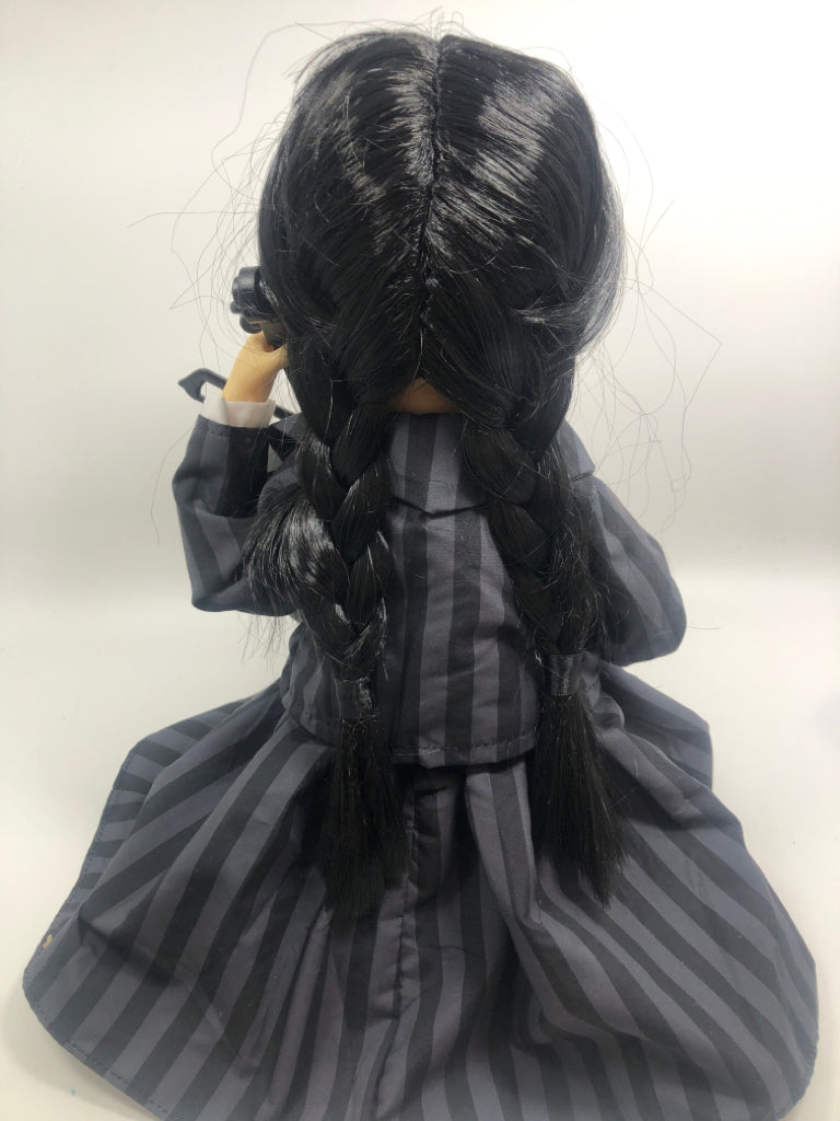 MUSICAL WEDNESDAY ADAMS PLAYING CELLO.
