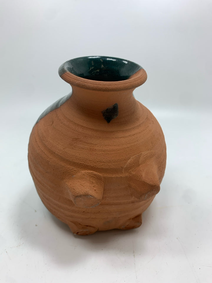 TERRA COTTA PIGGY BANK W/GREEN GLAZE.