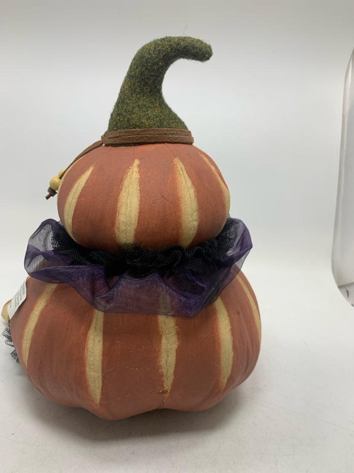 PRIMITIVE PAINTED PLUSH SITTING PUMPKIN WITH RUFFLES.