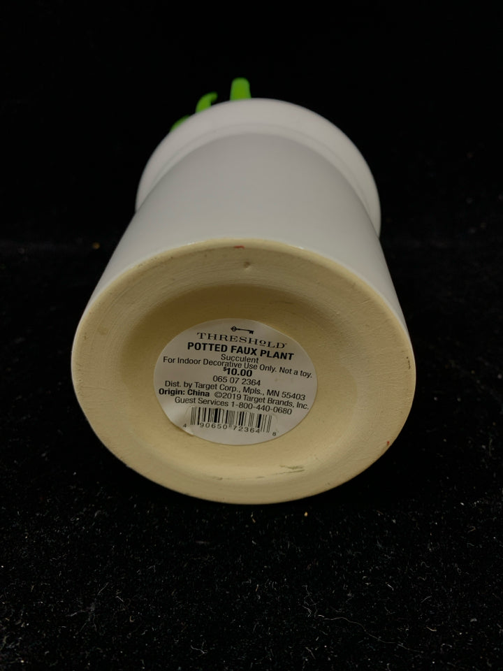 FAUX SUCCULENT IN WHITE POT.