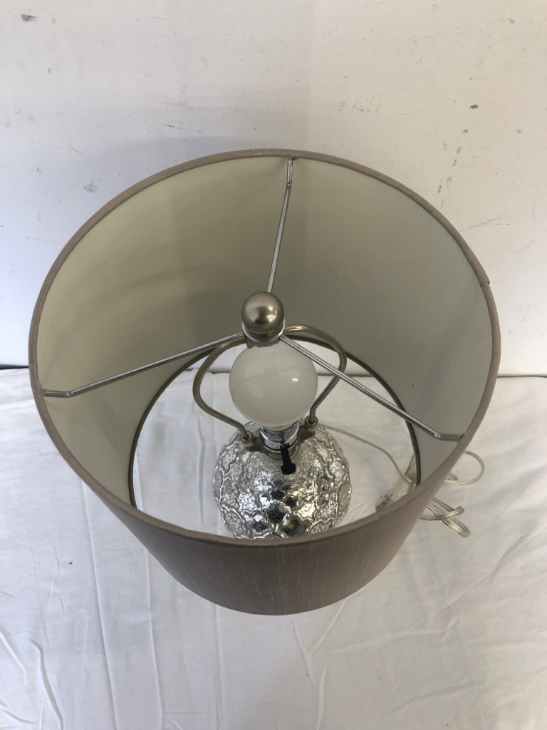 SILVER MERCURY BASE LAMP W TAN SHADE.