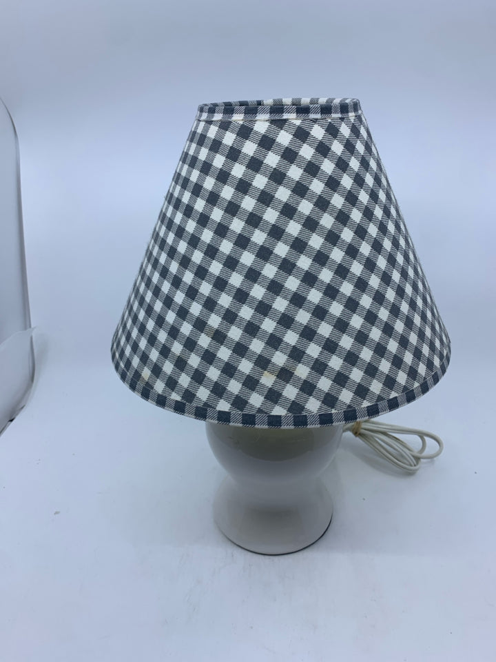 SMALL WHITE BASE LAMP W GREY CHECKERED SHADE.