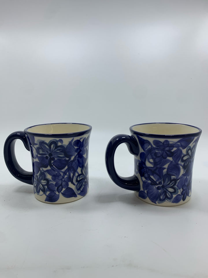 2 NAVY FLORAL PAINTED MUGS.