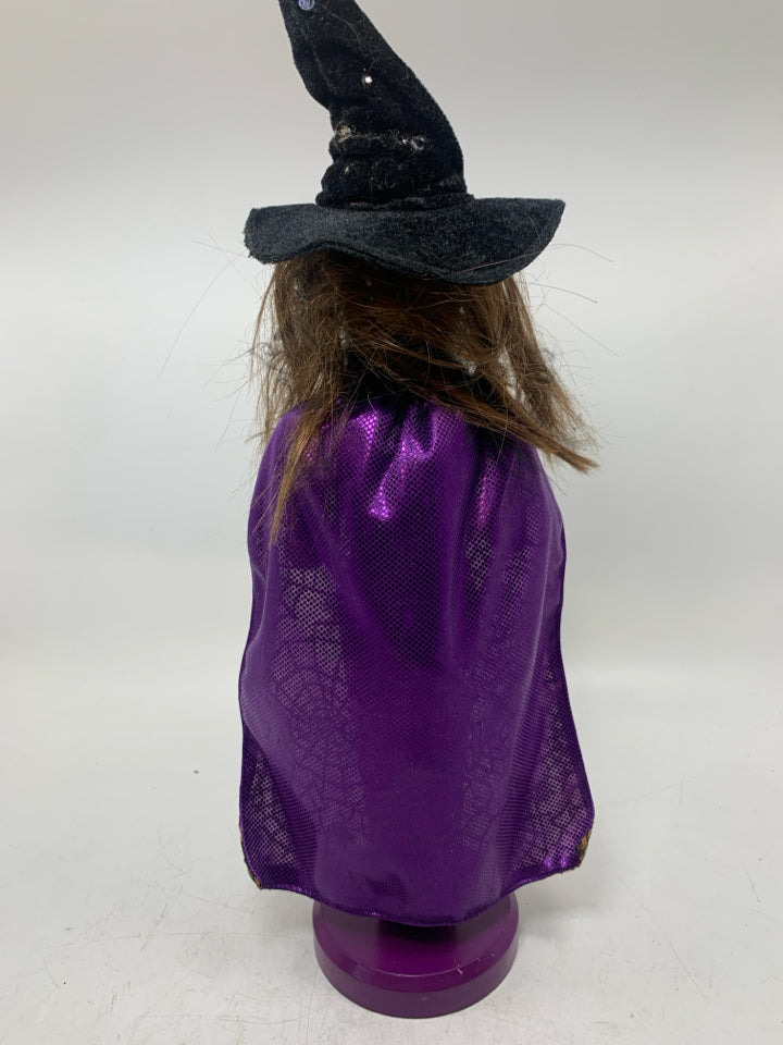 WITCH IN GLITTER DRESS.