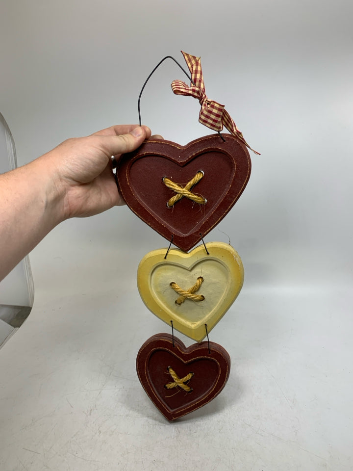 3 STACKED HEARTS WALL HANGING.