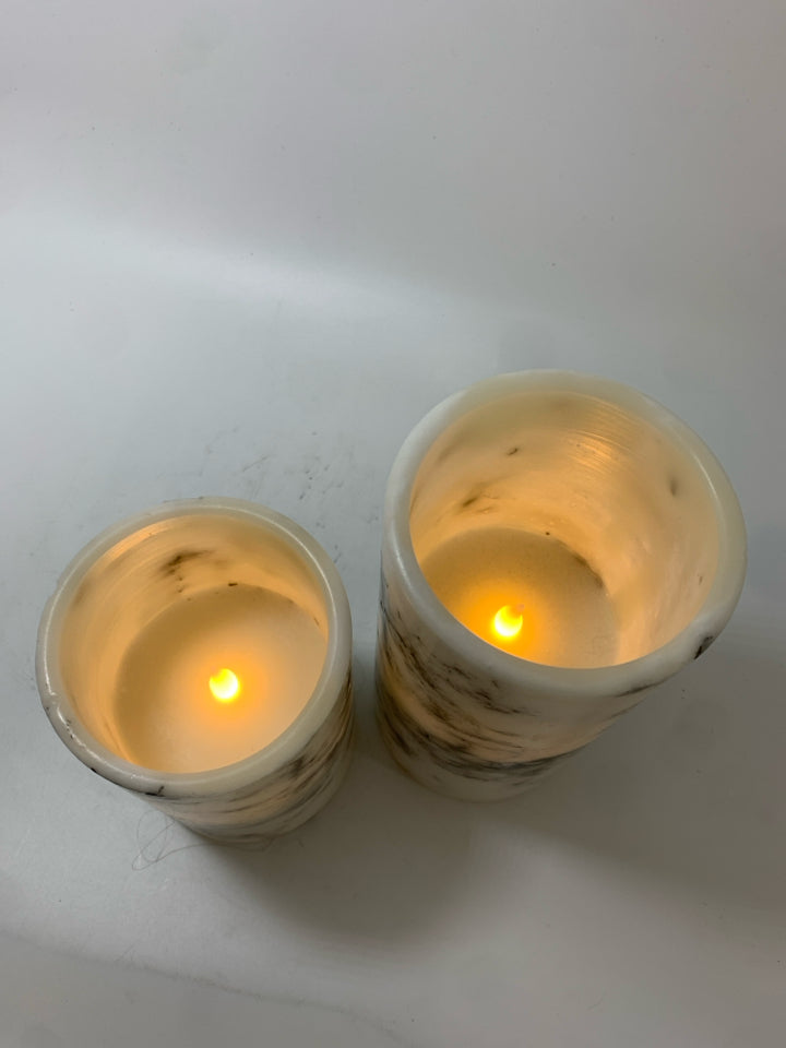 2 FAUX MARBLE RESIN LED CANDLES.