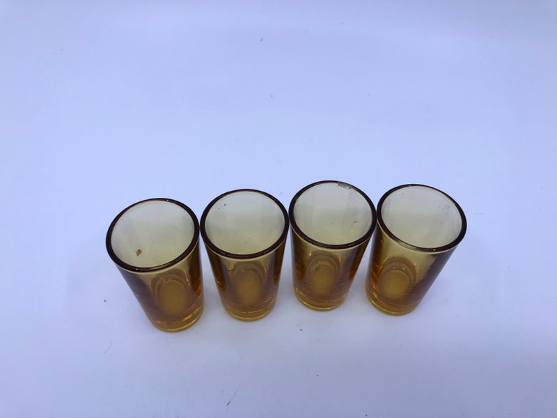 4 SMALL AMBER SHOT GLASSES.