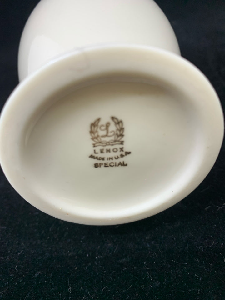 FOOTED PLAIN IVORY LENOX VASE W/ GOLD DETAILS.