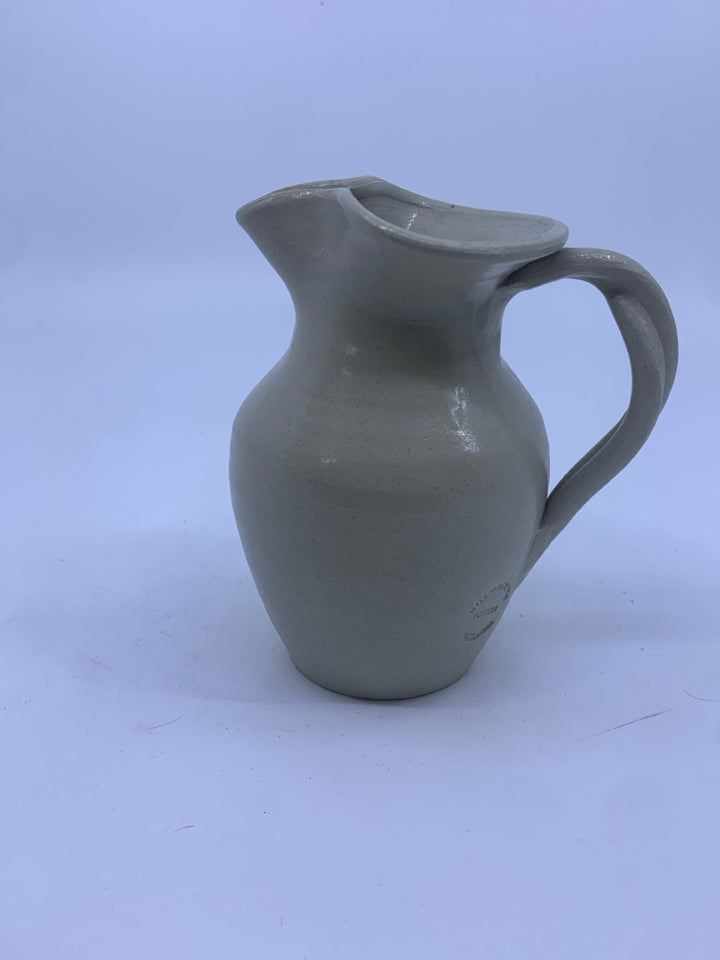 SMALL POTTERY JUG W/BLUE FLOWER.