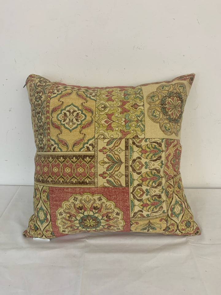 RED AND TAN MANDALA PATTERN PILLOW.