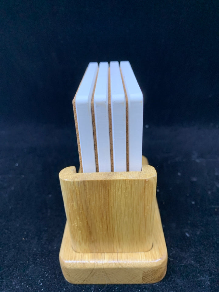 4 NIB WINE BOTTLES STONE COASTERS IN STAND.