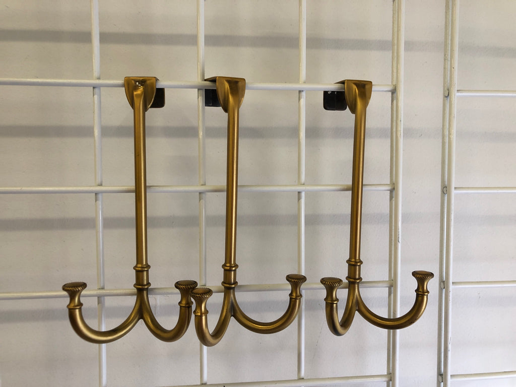3 GOLD METAL OVER THE DOOR HOOKS.
