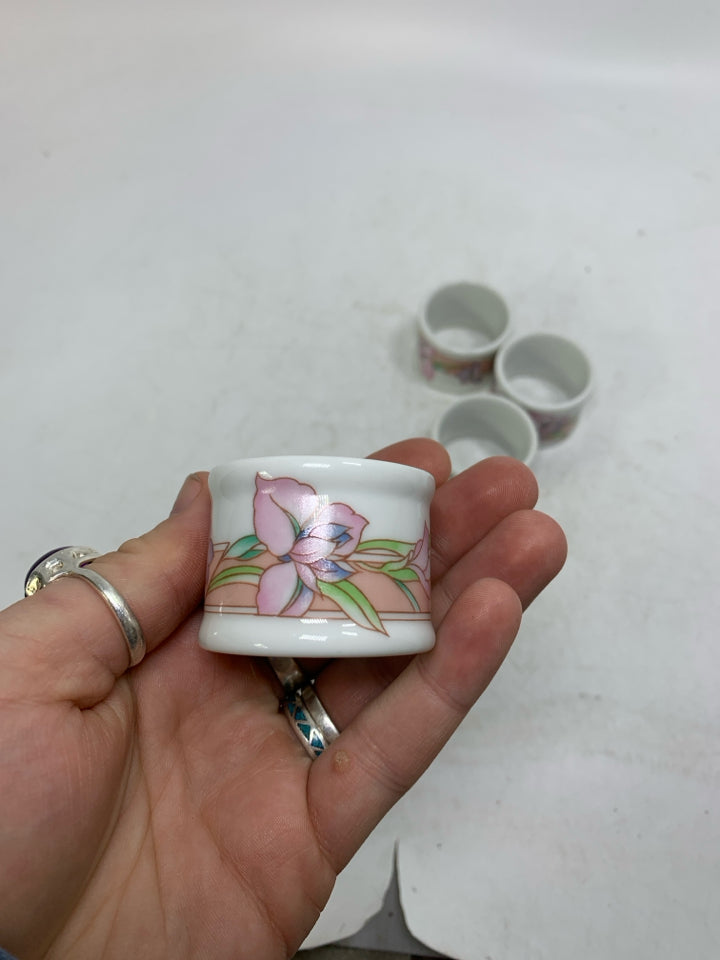 4 FLORAL PORCELAIN NAPKIN RINGS.