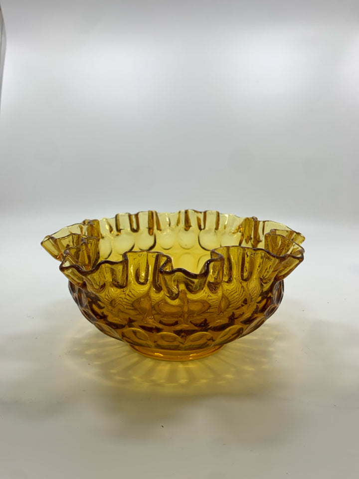 VTG AMBER GLASS THUMBPRINT BOWL W/ RUFFLED EDGE.