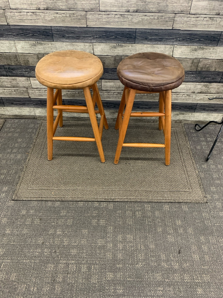 2 WOOD BAR STOOLS W FAUX LEATHER COVERS.