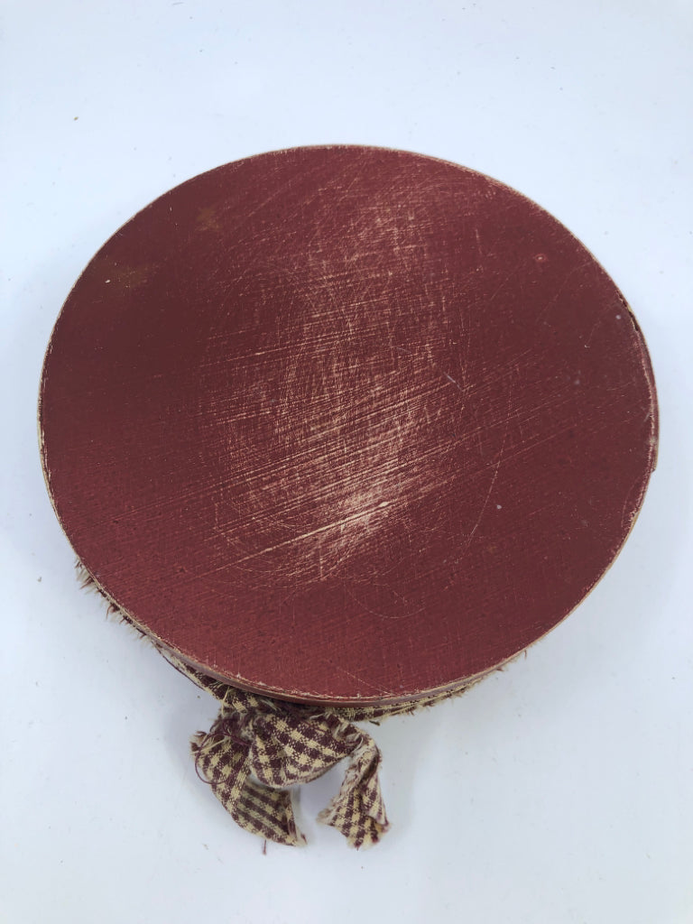 ROUND RED BOX W PLAID RIBBON.