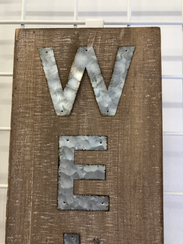 METAL "WELCOME" ON WOOD WALL/STANDING.