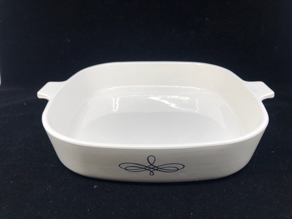 WHITE BAKING DISH WITH SCROLL DESIGN.