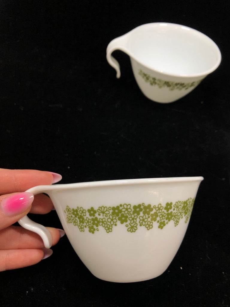4 CORELLE GREEN FLOWER COFFEE MUGS.