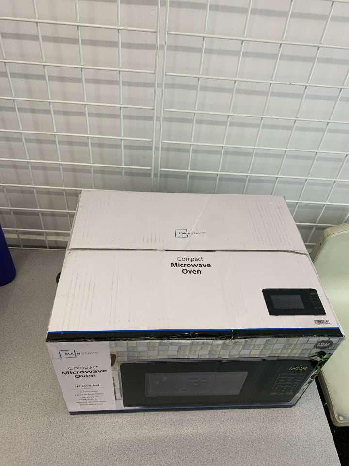 NIB MICROWAVE OVEN.