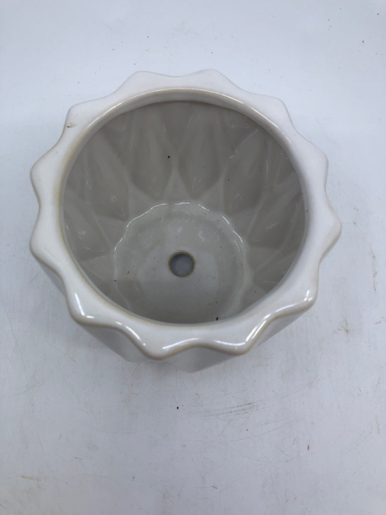 WHITE CERAMIC STAR SHAPED PLANTER W/ DRAIN HOLE.
