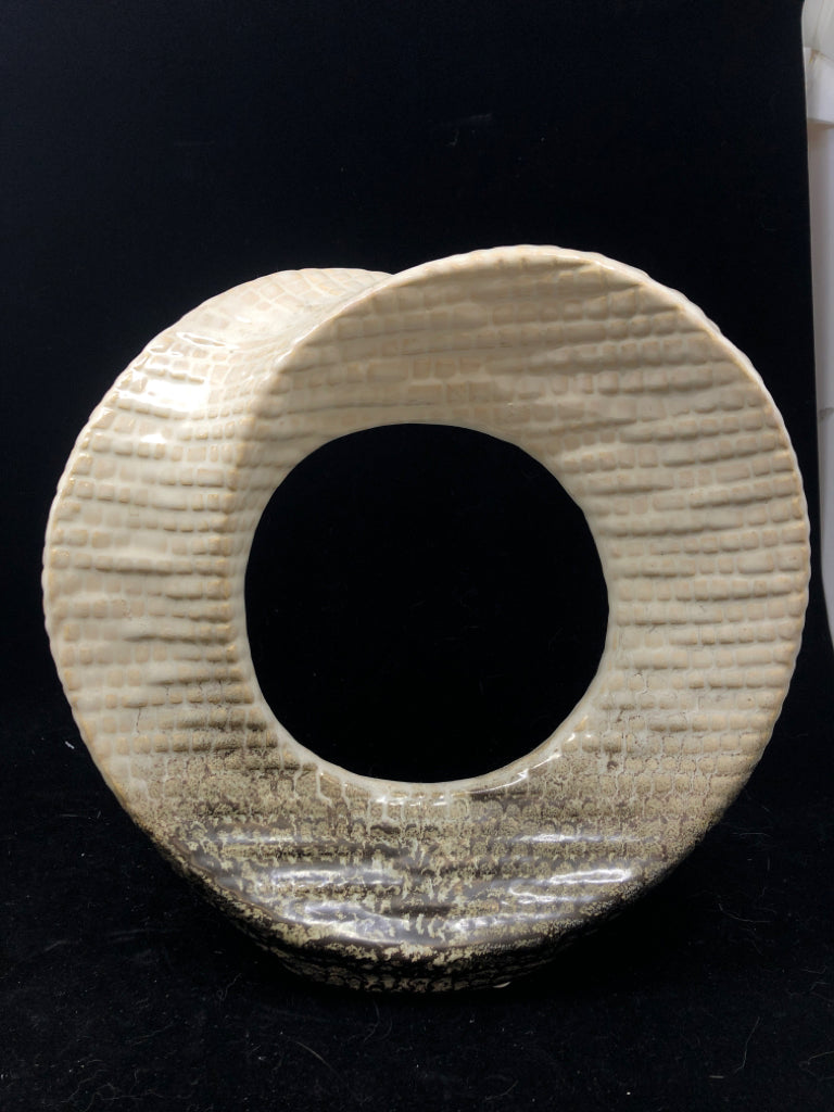 ABSTRACT CIRCULAR CUTOUT SCULPTURE CREAM AND BROWN.