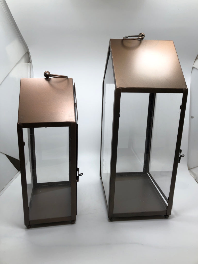 2 BROWN METAL CANDLE LANTERNS.