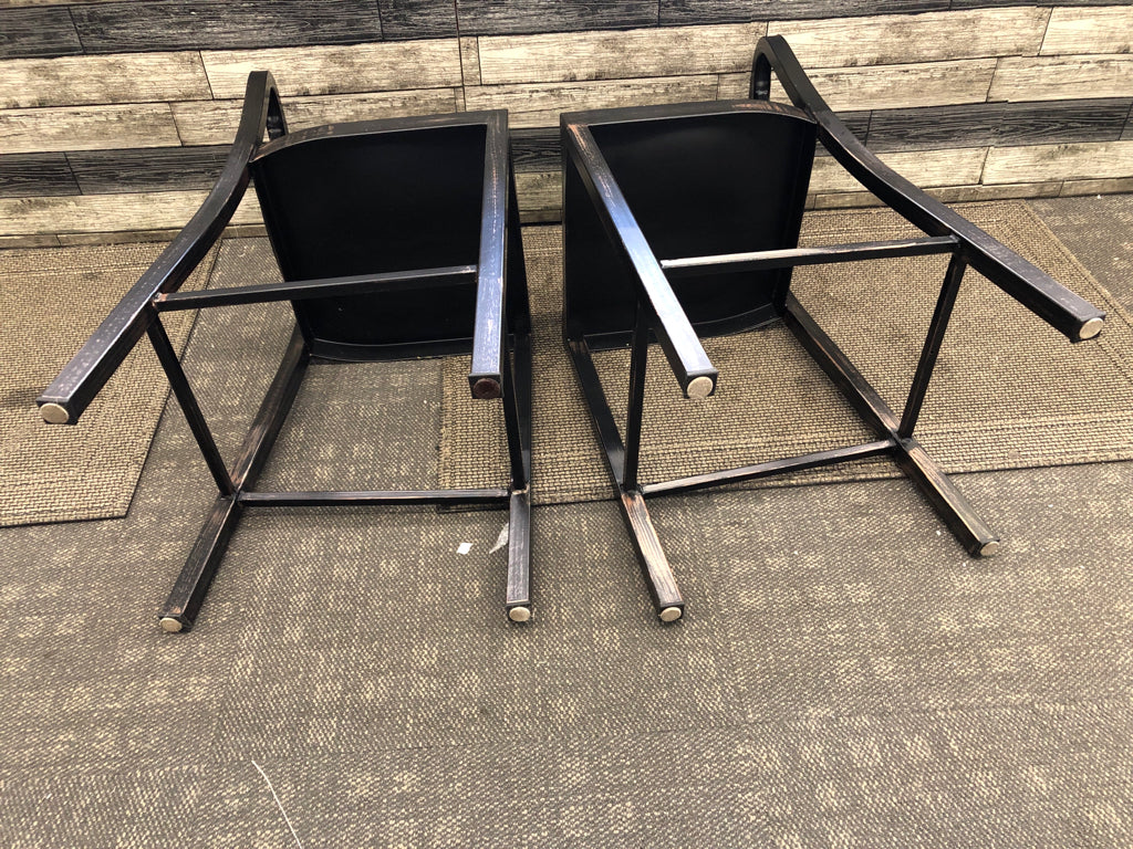 2 BLACK METAL DISTRESSED LOW BACK STOOLS.