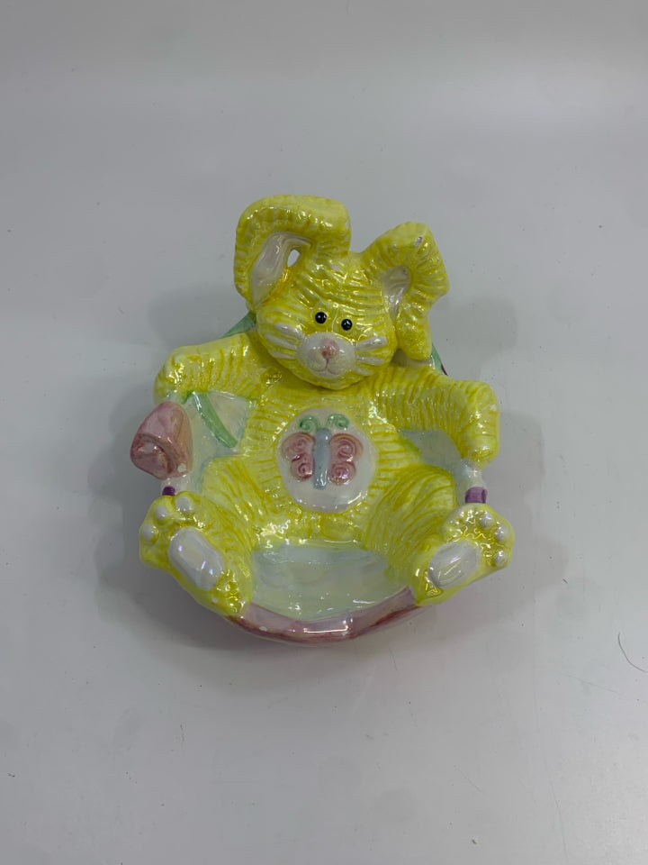 IRIDESCENT BUNNY RELAXING IN EGG.