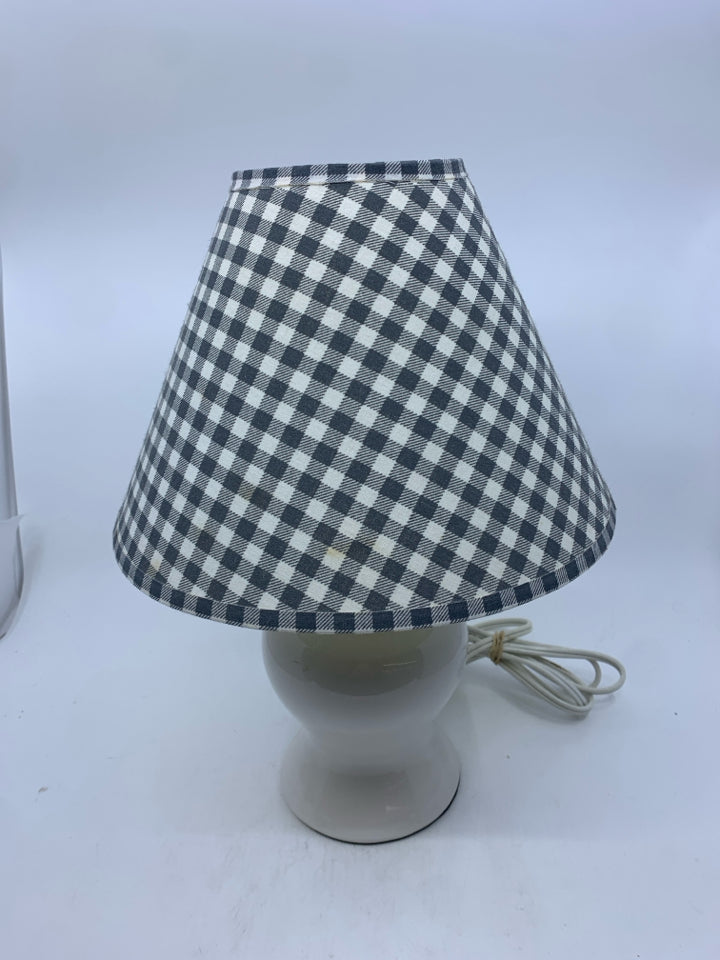 SMALL WHITE BASE LAMP W GREY CHECKERED SHADE.