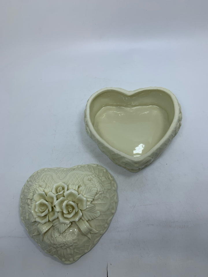 CERAMIC HEART SHAPED CANISTER W/ EMBOSSED ROSES & RIBBON.