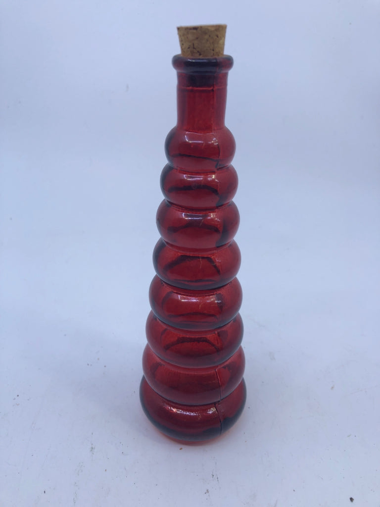 RED GLASS RIBBED BOTTLE W/CORK.