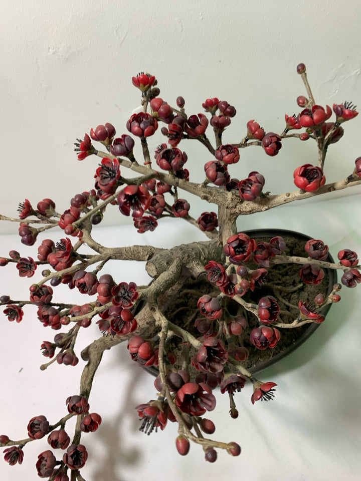FAUX BONSAI TREE W/ RED FLOWERS IN OVAL PLANTER.