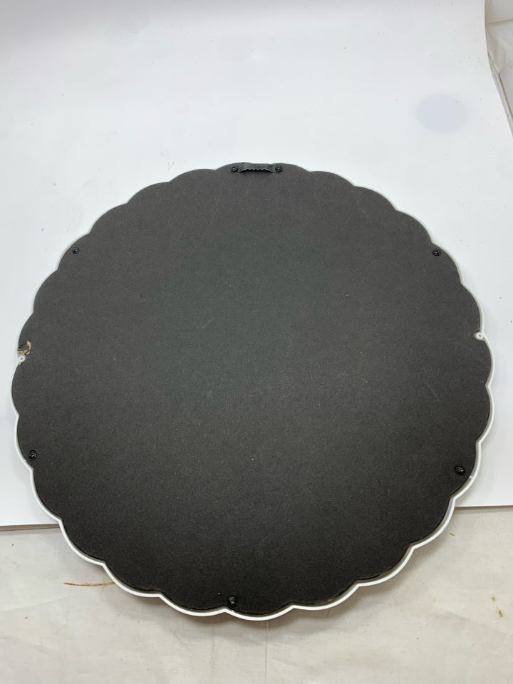 CIRCLE MIRROR W/WHITE PLASTIC BORDER.